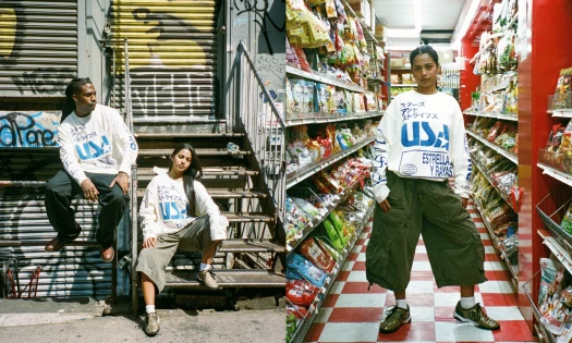Models wear WIGZ’s white Immigrant Jersey featuring “USA” in blue multilingual typography across street and grocery-store settings.
