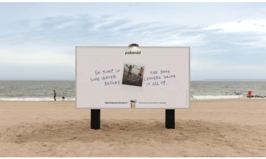 A Polaroid OOH ad by the beach