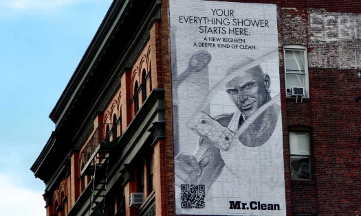 Mr. Clean Billboard on the side of a building promoting "Your Everything Shower Starts Here."