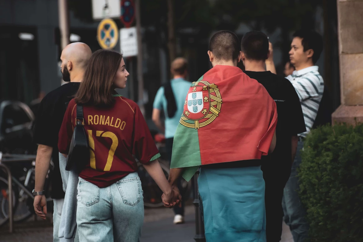 Two football fans walking side by side