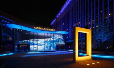 Nighttime photo of the entrance to the National Geographic Museum of Exploration.