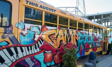 A spray painted school bus promoting Camp Rock 3 premiering this August.