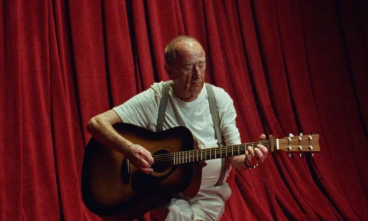 An old man with a guitar