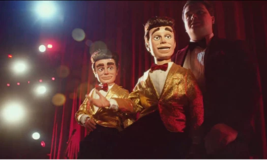 Two puppets on a stage