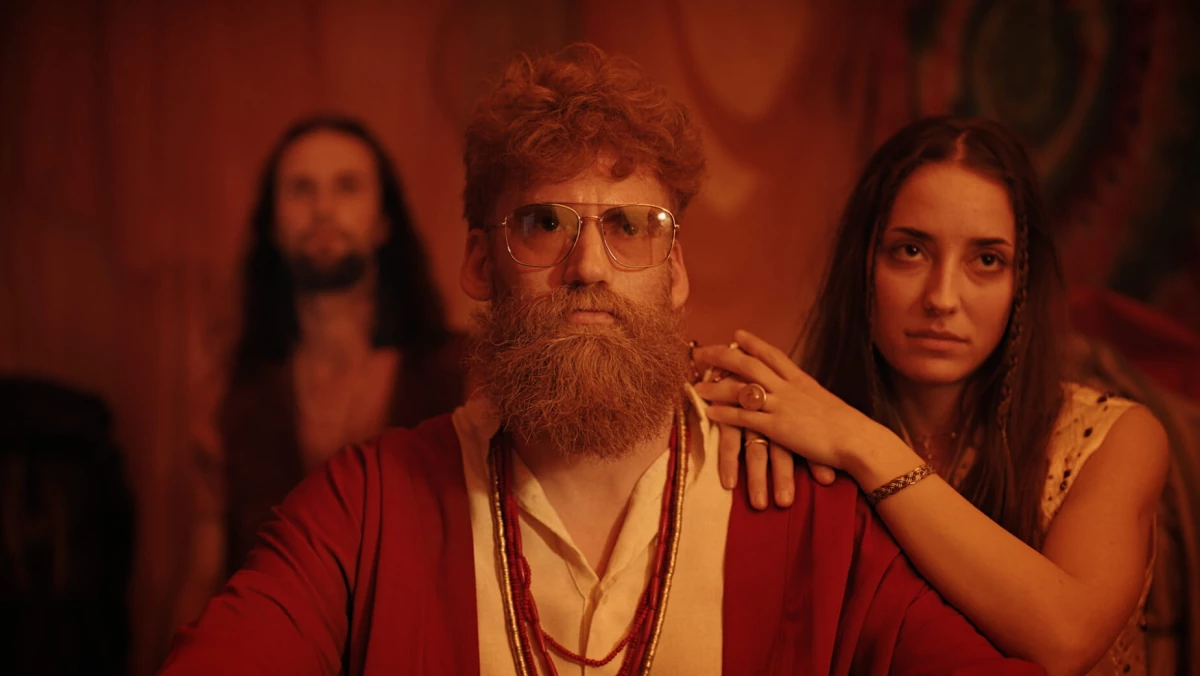 A bearded man together with a woman