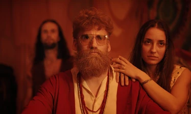 A bearded man together with a woman