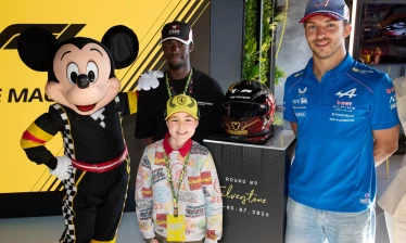 A child with Mickey Mouse