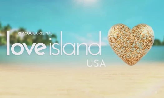 Love Island USA Peacock Original with a sand shaped heart with a tropical beach background.