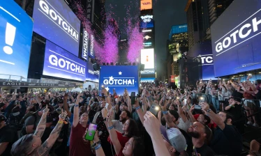 New York Times Square screens displaying Pokémon GO activation countdown.
