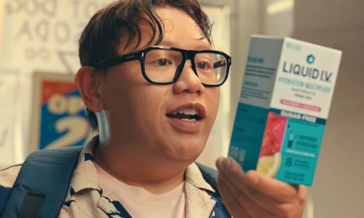 Jacob Batalon reading off a Liquid I.V. product.