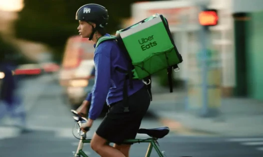 Uber Eats delivery person on a bicycle.