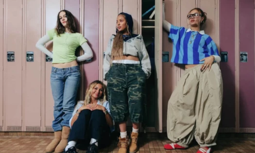 Four teenagers posing by the school hallway
