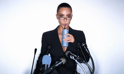 Kim Kardashian behind a microphone