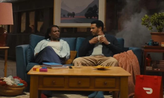 Two people talking on a couch