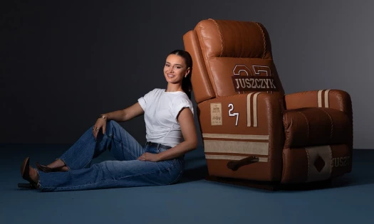Kristin Juszczyk sits next to a La-Z-Boy "Jer-Z-Boy" recliner.
