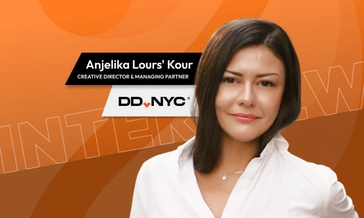 Interview graphic for Anjelika Lours' Kour, Creative Director and Managing Partner at DD.NYC, shown against an orange "Interview" branded background with the DD.NYC logo.