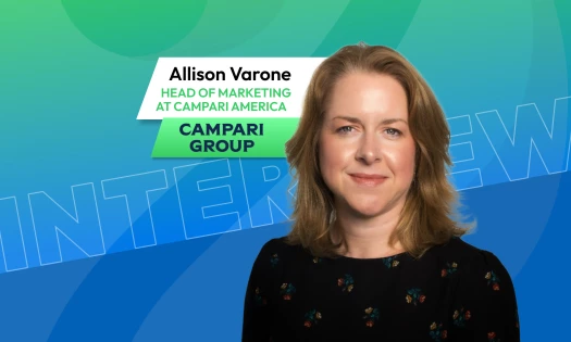 Portrait of a Allison Varone beside text reading “Allison Varone, Head of Marketing at Campari America, Campari Group,” on a blue and green DesignRush interview graphic.