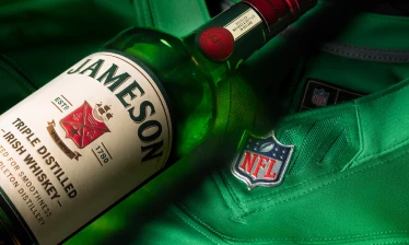 A Jameson bottle over an NFL jersey