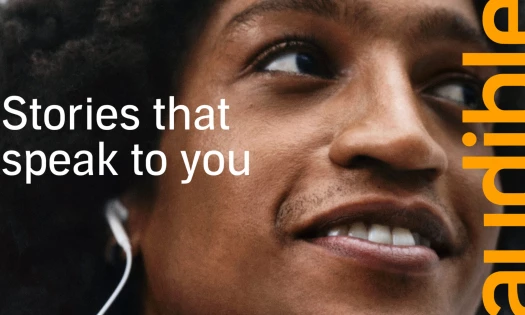 A woman listening to Audible though her earphones