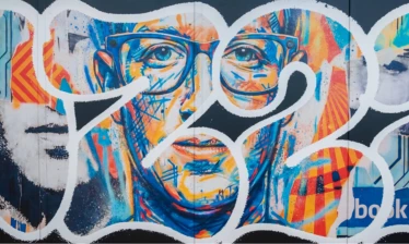 A mural of Meta CEO Mark Zuckerberg, his Facebook banner