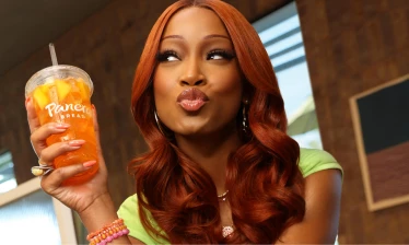 Keke Palmer holding up a Panera drink