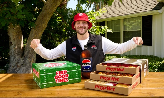 Josh Allen with boxes of Pizza Hut