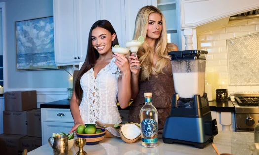 Sisters Brooks and Grace Ann Nader posing with the ingredients to make Astral's Midnight Margaritas.