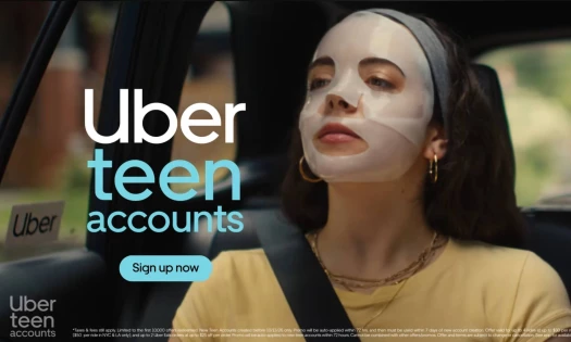 A teenager with a face mask on in an Uber ride with the text: Uber teen accounts, sign up now