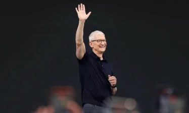 Tim Cook waving to an audience