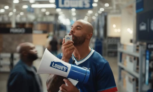 A man using a Lowe branded megaphone