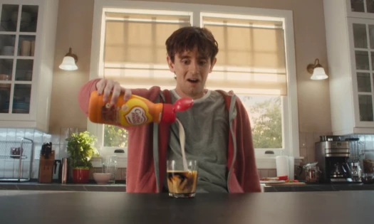 A man pouring Coffee mate into his morning drink