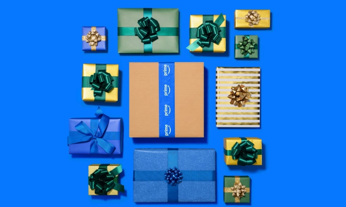 A promotional image for Prime Big Deal Days showing wrapped gifts surrounding a signature Amazon delivery box