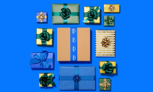 A promotional image for Prime Big Deal Days showing wrapped gifts surrounding a signature Amazon delivery box