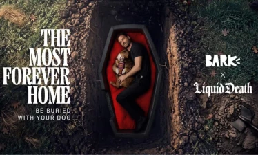 A man and his dog inside a coffin that fits both of them