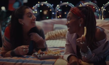 Two women chatting over their DoorDash delivery order