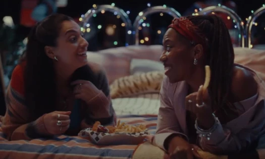 Two women chatting over their DoorDash delivery order