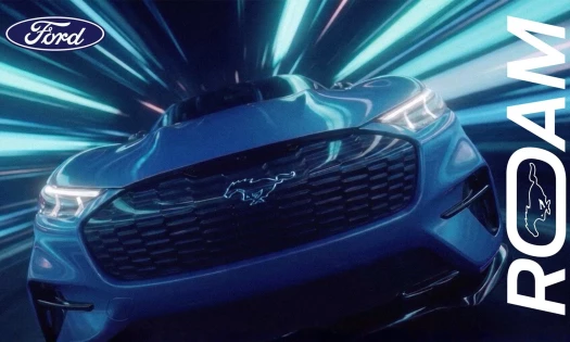 Ford Mustang Mach-E in electric blue cinematic styling.