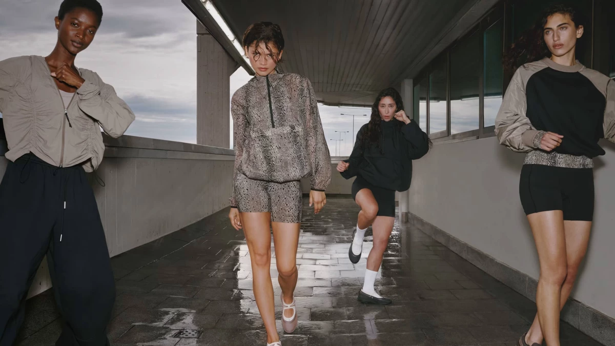 Zendaya walking along a hallway with her enemies