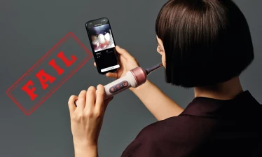 Model using Dyson's CameraJet phone camera features with a red "fail" stamp to the left of the image.