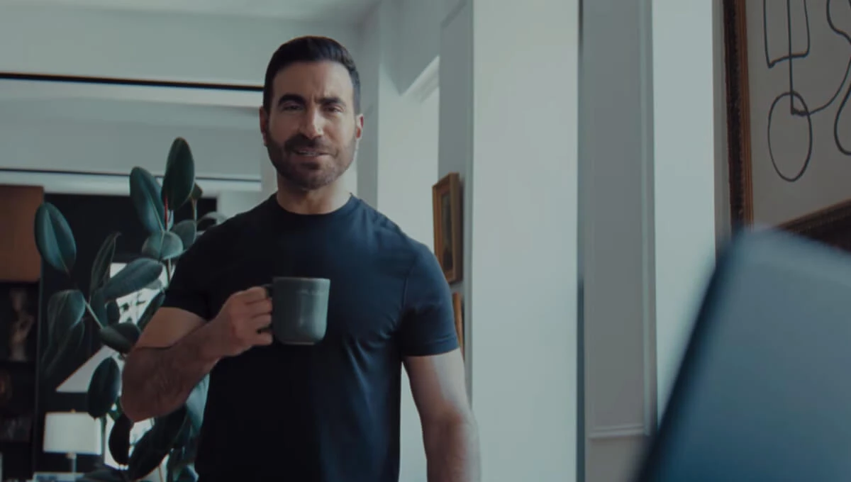Brett Goldstein holding a cup of coffee
