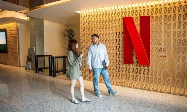 Netflix office with two people having a conversation.