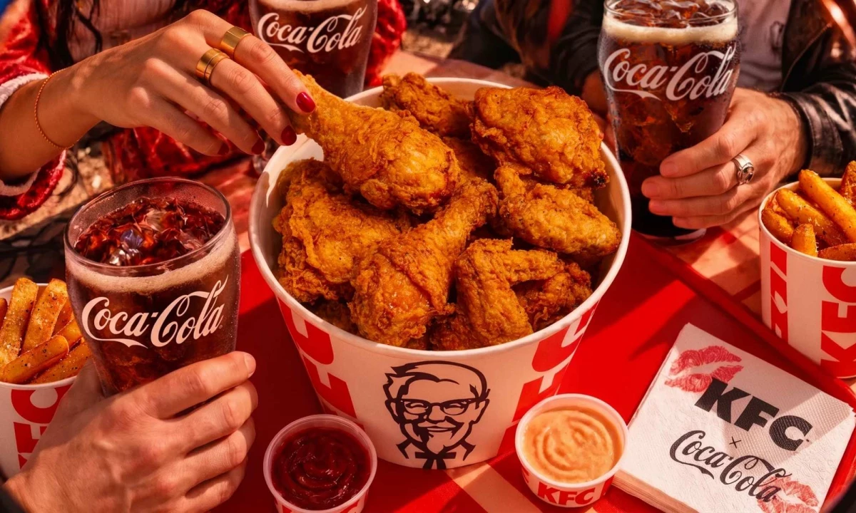 KFC buckets with sides and Coca-Cola.