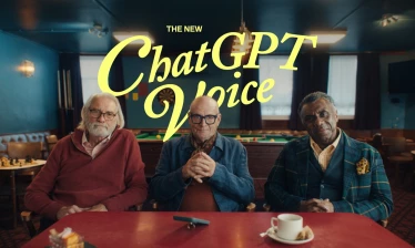 Three grandpas sitting by a pub