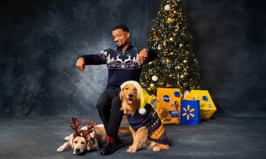 Alfonso Ribeiro with his dogs and Pedigree products behind him