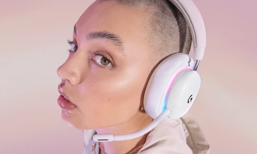 Logitech G - Maybelline New York partnership: a woman wearing Logitech G G735 Wireless Gaming Headset