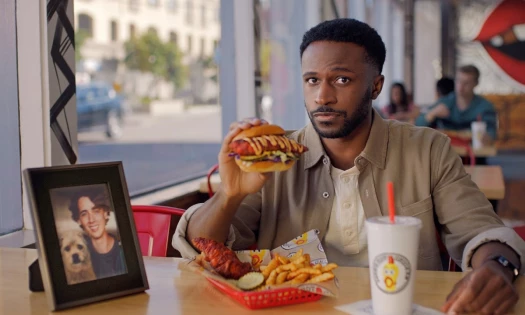 A man enjoying a new item on the menu in a restaurant