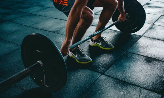 Man lifting weights in gym