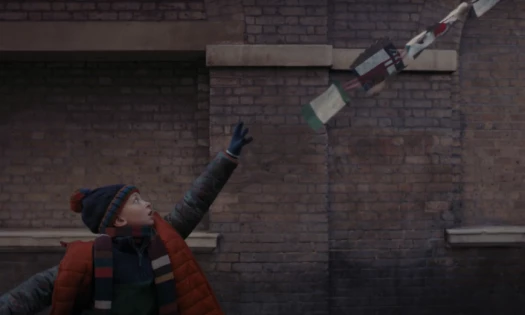 Boy reaching out to try and grab his Christmas list as it flies away