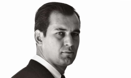 Black and white portrait of George Lois as a young man
