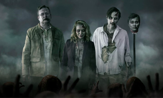 Four former Walking Dead characters as zombies walking through a mist